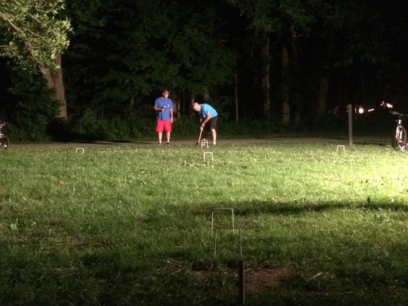 Competitive game of croquet while camping with all the cousins.