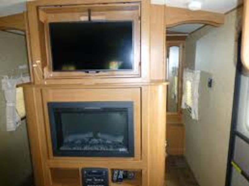TV and Fireplace both swivel to face into Master bedroom