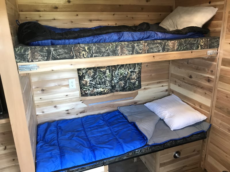 Side dinette converted to lower bunk bed.