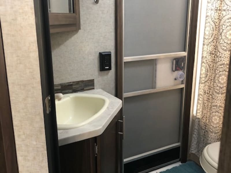 Bathroom with door access to outside