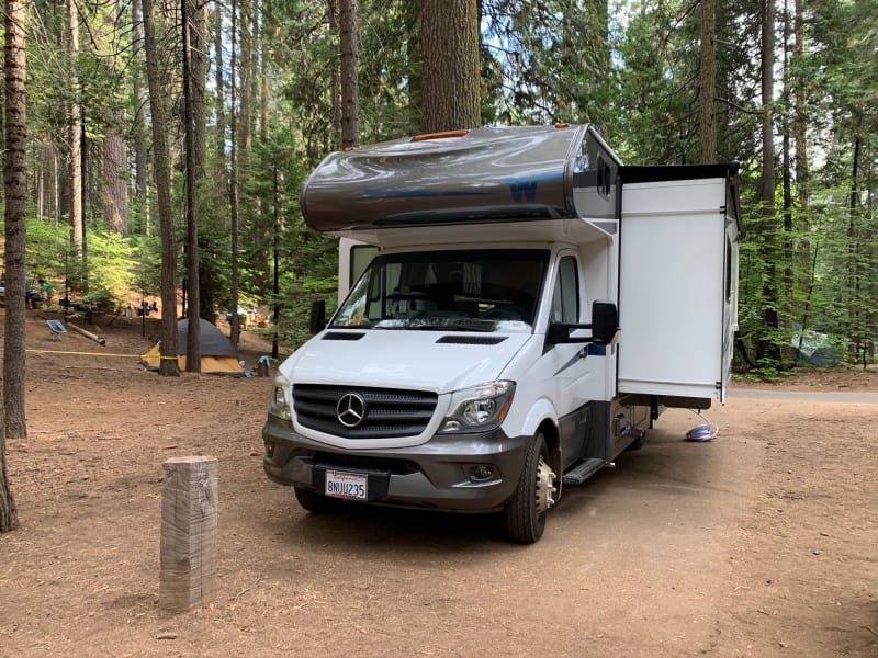Slide out, bike rack & bikes by light of campfire