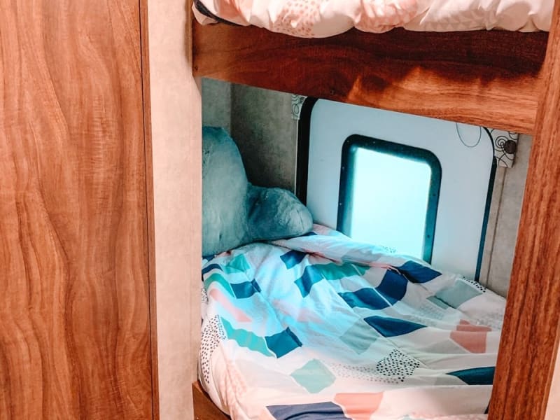 Lower bunk- twin holds 300 lbs- own light and window