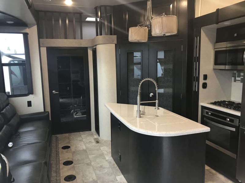 Living space facing rear garage, showing loft space above.
