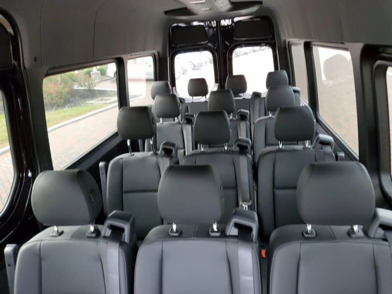 Configured with all 4 rows of rear seating.  We typically keep it configured with 3 rows (12 Passenger) for additional rear legroom and storage.