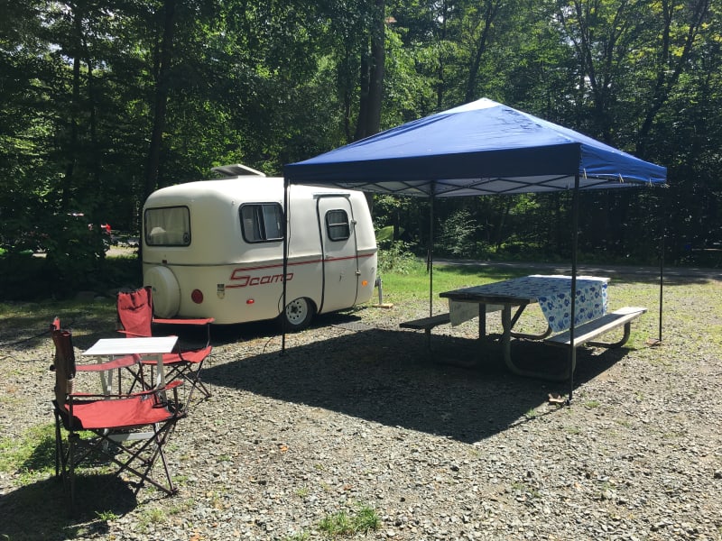 Scamp All American trailer with pop up tent, camp chairs and table cloth - all included in rental