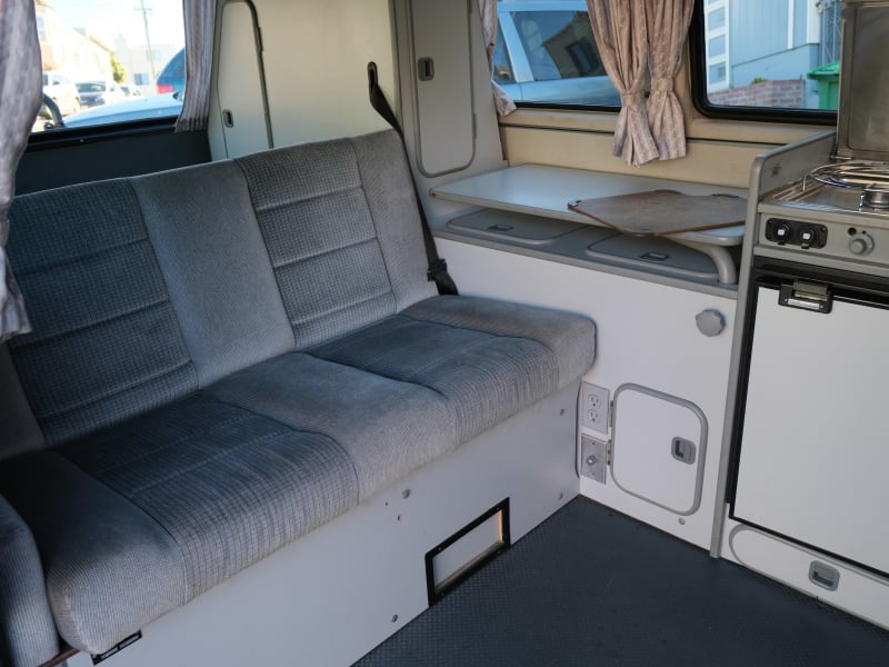 Bench seat folds to bed, which sleeps 2. Table pulls out for dining and gaming. Good storage under seat too.