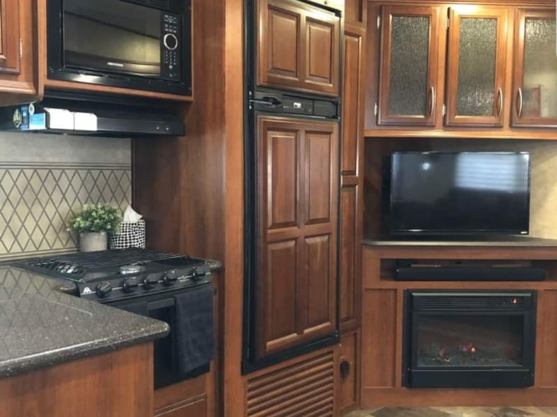 Enjoy a good movie while keeping yourself warm with the fireplace 