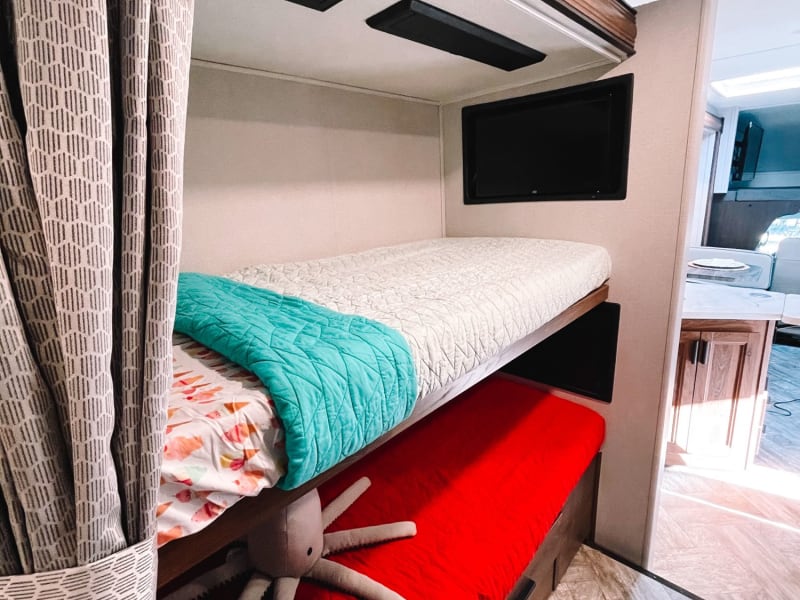 Each bunk bed has their own personal TV