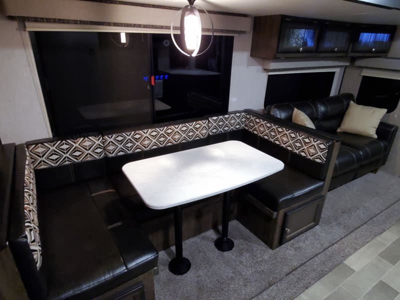 Large U-shaped dinette that also converts to a bed.