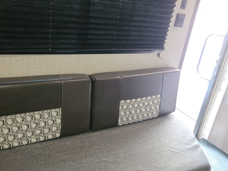 Nice little couch to lounge on.  Has 2 tv type trays for your dining pleasure