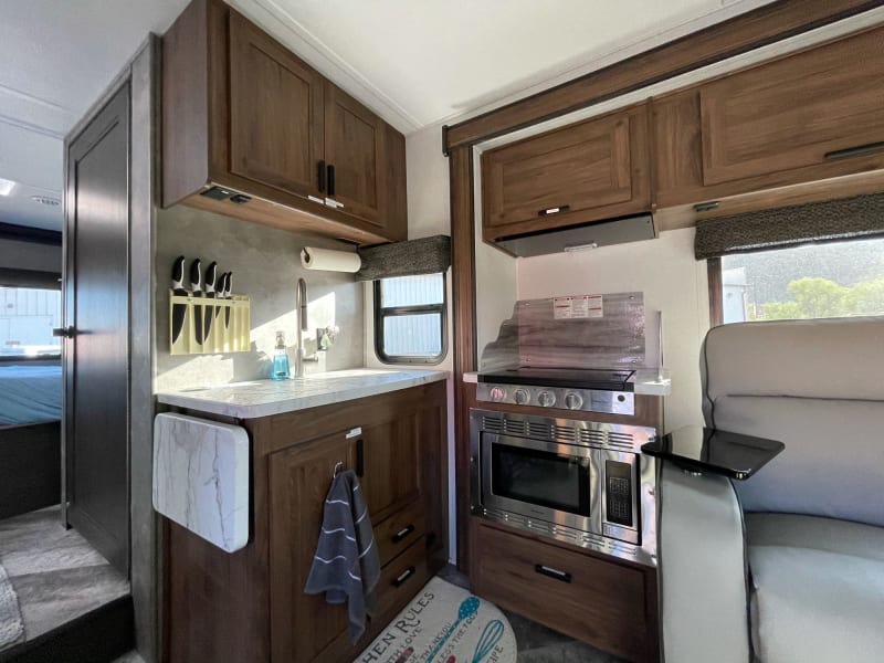 Just what you need for RV cooking. Convection microwave and extra counter space folds down for driving convenience. 