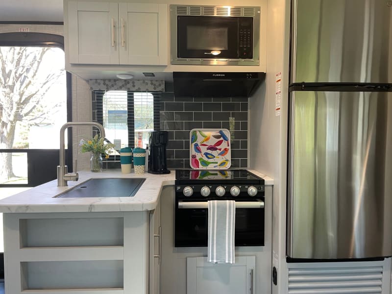 Large, 8 cubic foot residential refrigerator and freezer, gas range and oven, microwave all help make your trip a breeze!