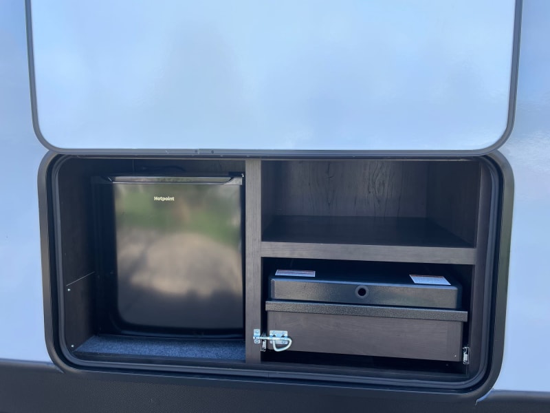 Everything packs up neatly, and standard outlet available in storage area for coffee maker or other items.