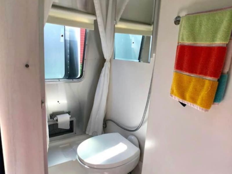 Bathroom with shower. Can also take shower outside of camper.