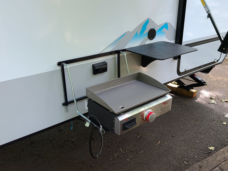 Grill, Outdoor water connection and mini table for  all cooking needs!