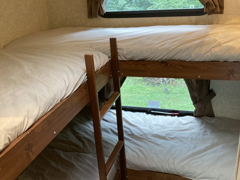 L-shaped bunks. Four 28”x 70” bunks