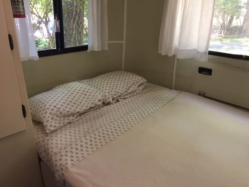 Comfy full sized bed with fresh linens and pillows included.