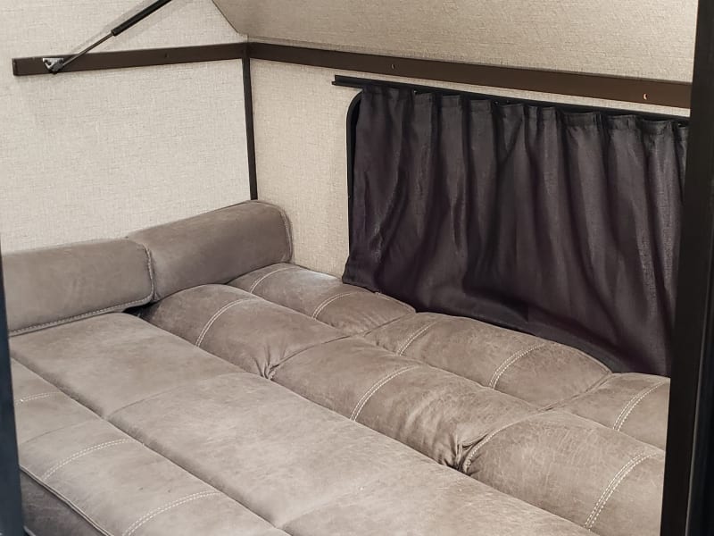 Couch in bunk area converted to bed for additional sleeping space. 
