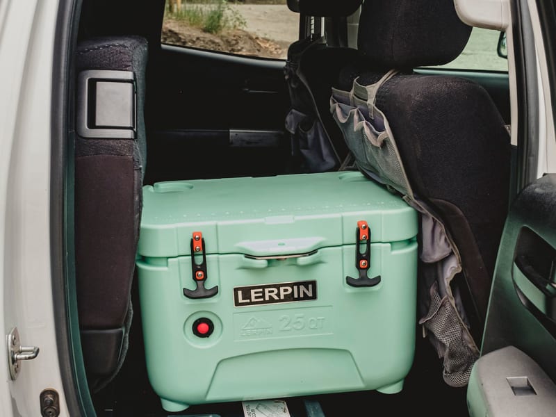 The passenger rear seat folds up you can carry your cooler in the cab for better access to snacks or drinks and save some ice. 