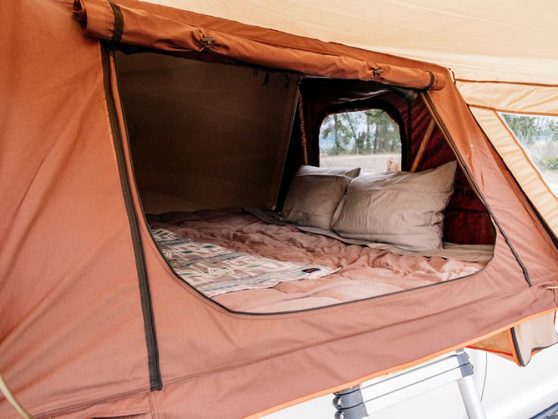 We include two pillows and fresh clean sheets, tent is rated for 3-4 adults, let us know if you need more pillows. 