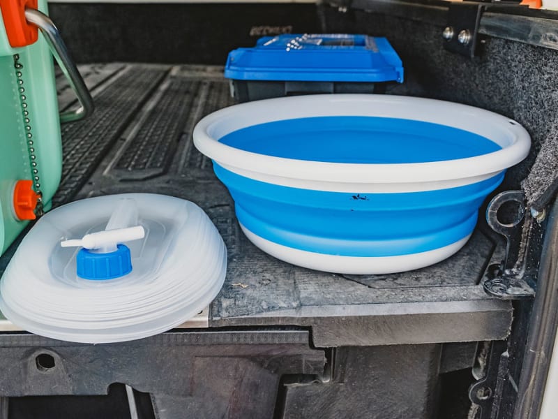 We also provide a dishwashing pan and a water jug for you,  we know everyone is different on where they choose to get water from so you decide!