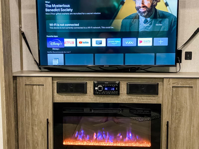 Smart TV wifi-ready and electric fireplace.