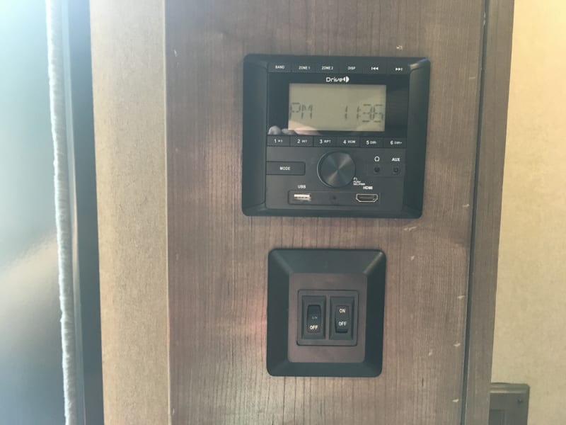 Radio w/ Indoor and Outdoor speakers. Also has bluetooth connectivity.