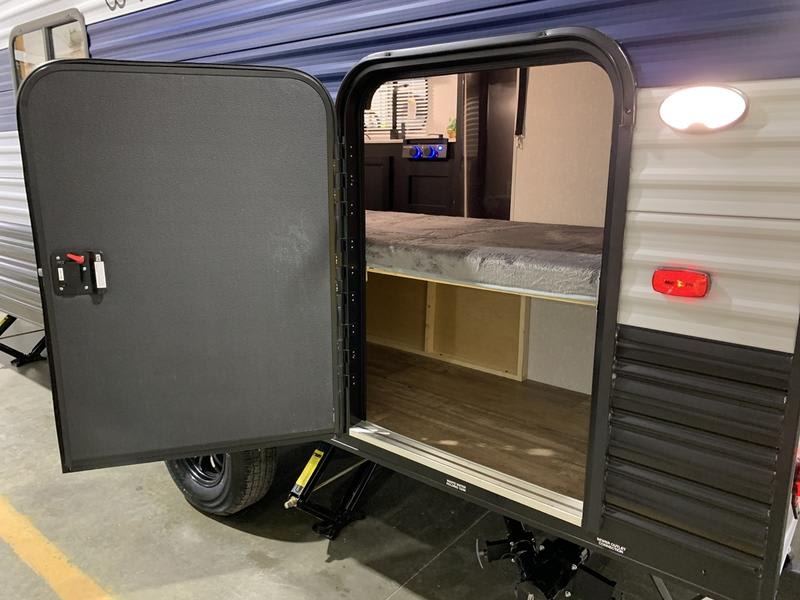 Bottom bunk folds up for additional storage.