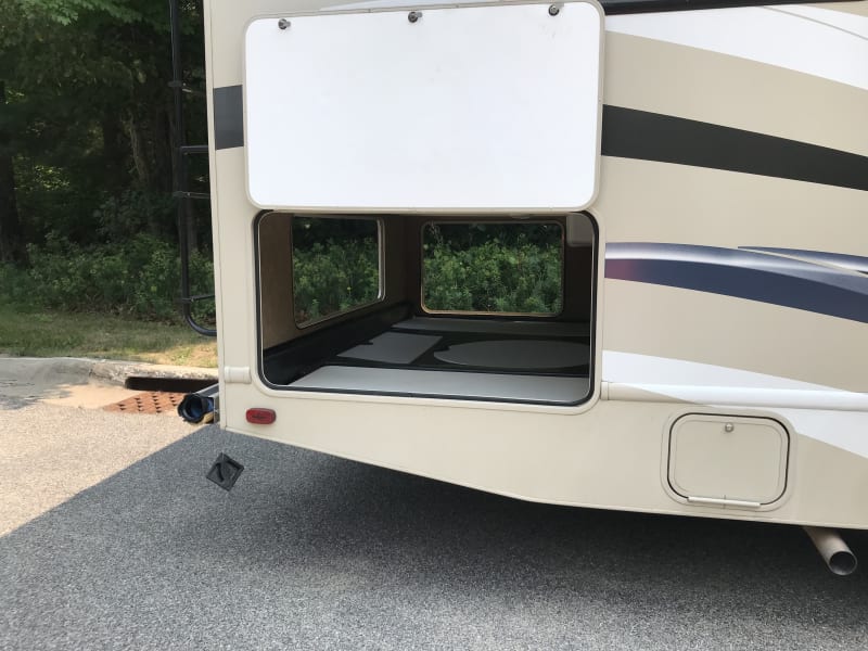 Storage garage with removable table