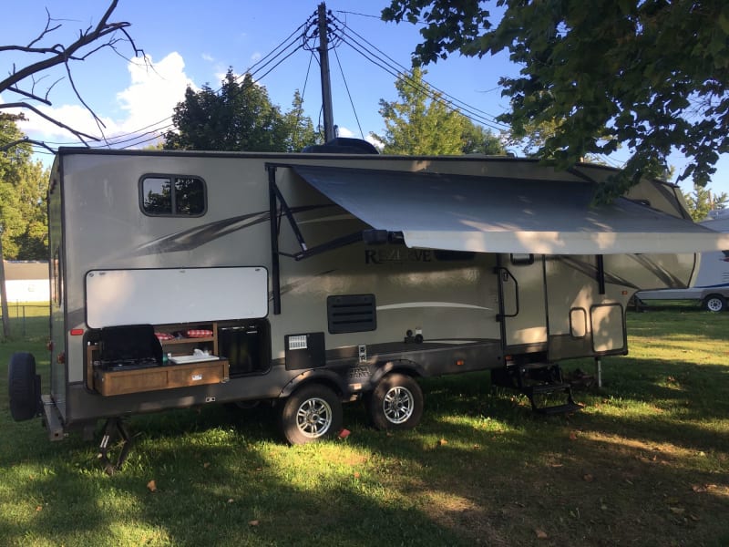 automatic awning and outdoor kitchen