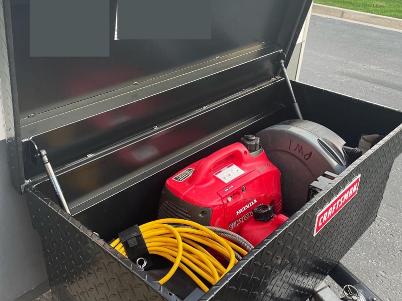 Large front storage box holding Honda 2200W Generator, toilet, and tools, and more! Makes the perfect off-grid setup!