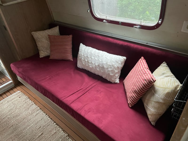 Rear twin bed converted into a couch.