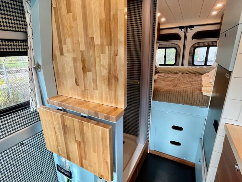 YES, that's right... it flips up and becomes a private bathroom and shower room - curtain behind the small acrylic door for your privacy.