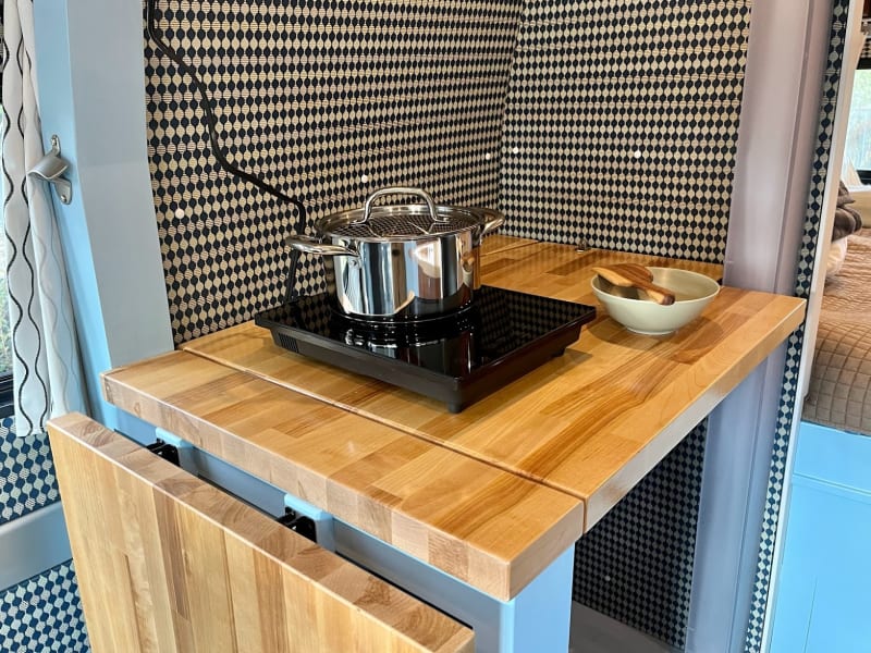 Feel free to use this counter for cooking and food prep. Outlets are right there.