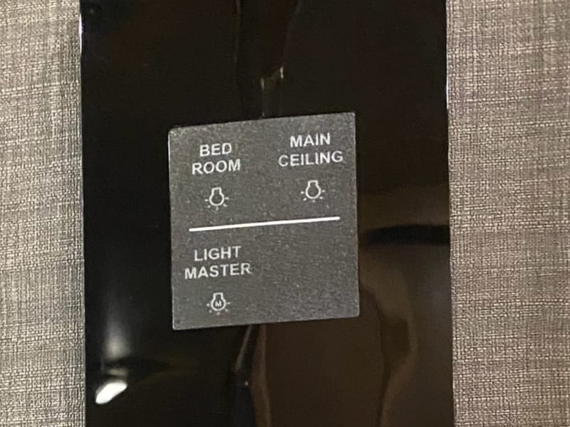Single touch lighting, slides, and temperature controls throughout the coach.