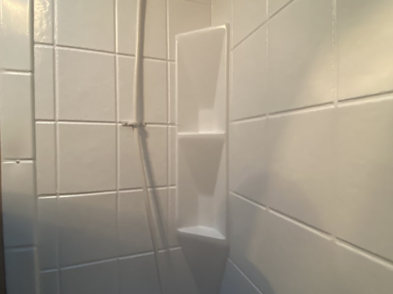 Full shower with a curtain that expands out for more room