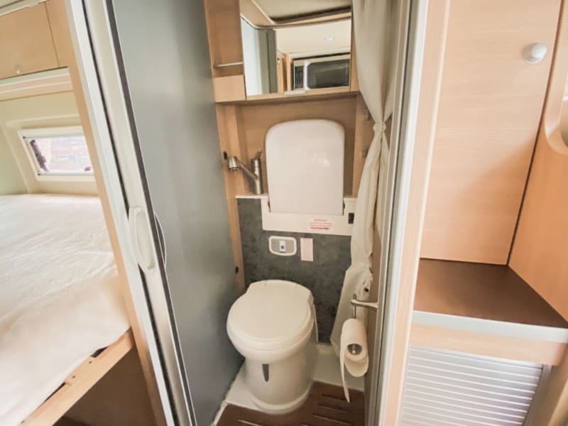 Bathroom includes sink, toilet and shower