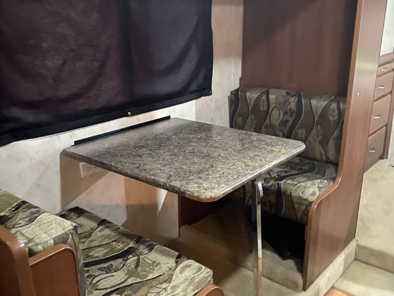 Dinette in bunkhouse area. Seating for two when bunks are folded up. TV can be viewed from this location.
