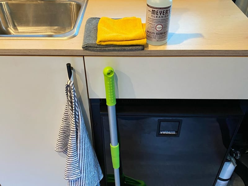 Van comes with cleaning spray, dish towels and collapsible broom to keep your space nice and tidy.