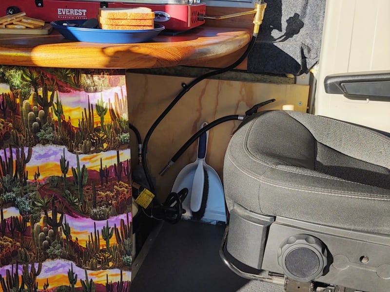 The driver's side chair can be pulled up to the table for dining.