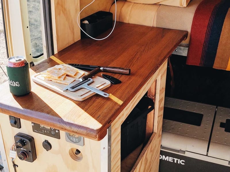 In this photo you can see the refrigerator/freezer, extra storage, and extra table space for prepping food.