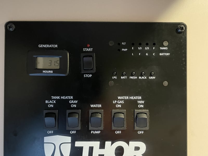 Control panel for black and gray water tank, fresh water pump, water heater, and tank levels