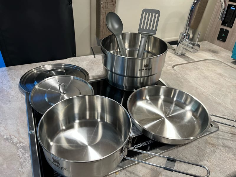 A full set of stainless pots and pans are included.