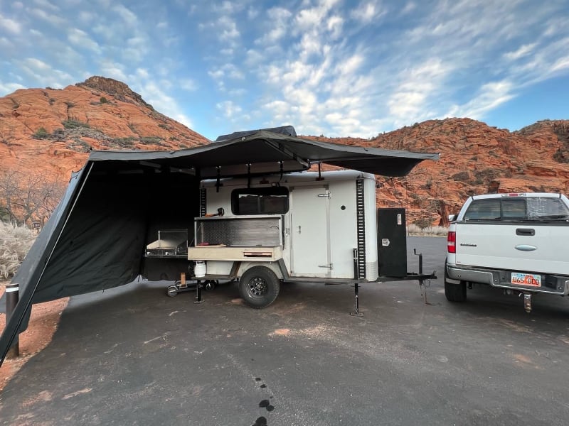 Awning, outdoor kitchen, sink, grill, leveling kit.