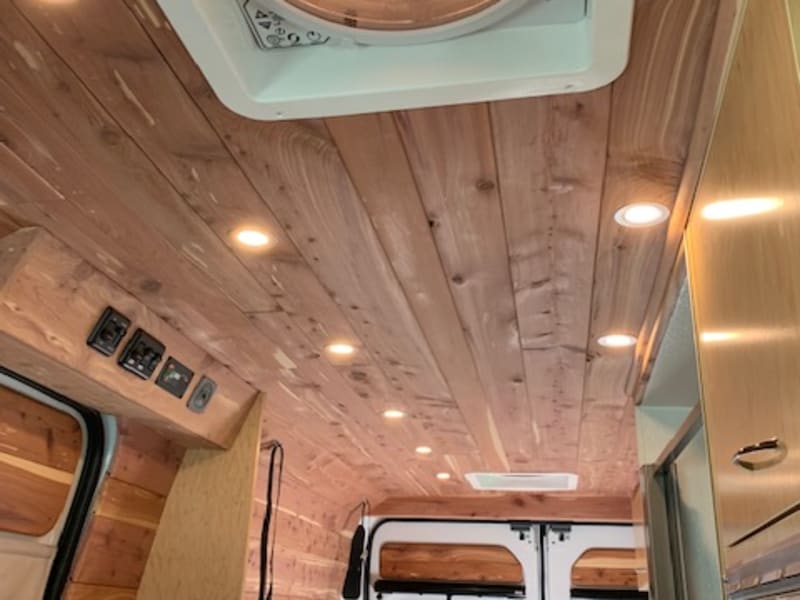 Natural wood interior with ceiling fans and lights with dimmer switch