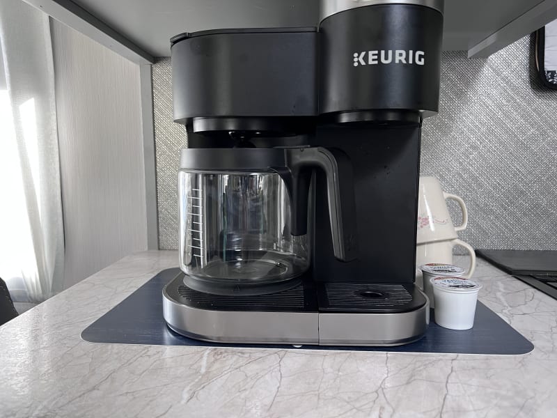 This Keurig Coffee appliance will cook a pot and k-cups.  Both types of coffee are provided, along with sugars and creamer and tea bags.