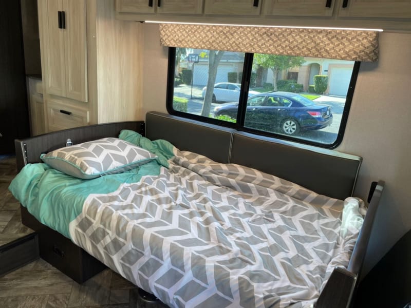convertible into a sleeping space (just remove the pedestal from the table).
