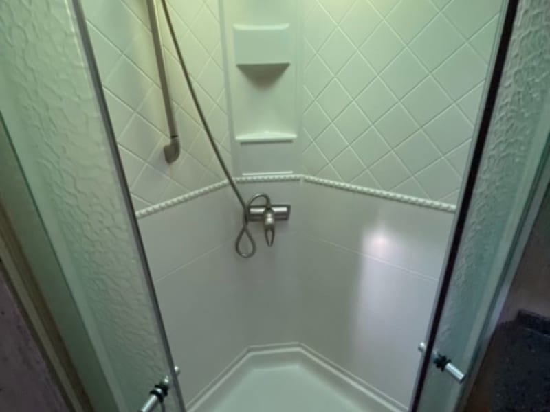 Full size shower great for taller people. Lot's of room