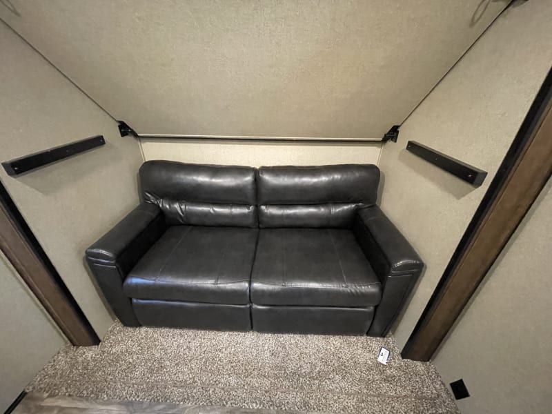 Full fold out couch below bunk