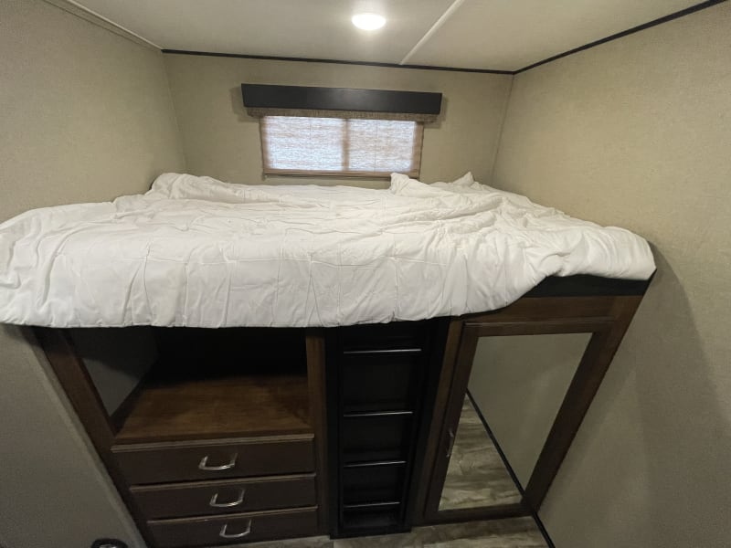Bunk with wardrobe and drawers below
